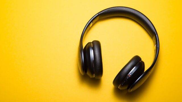 Yellow background and black headphones.